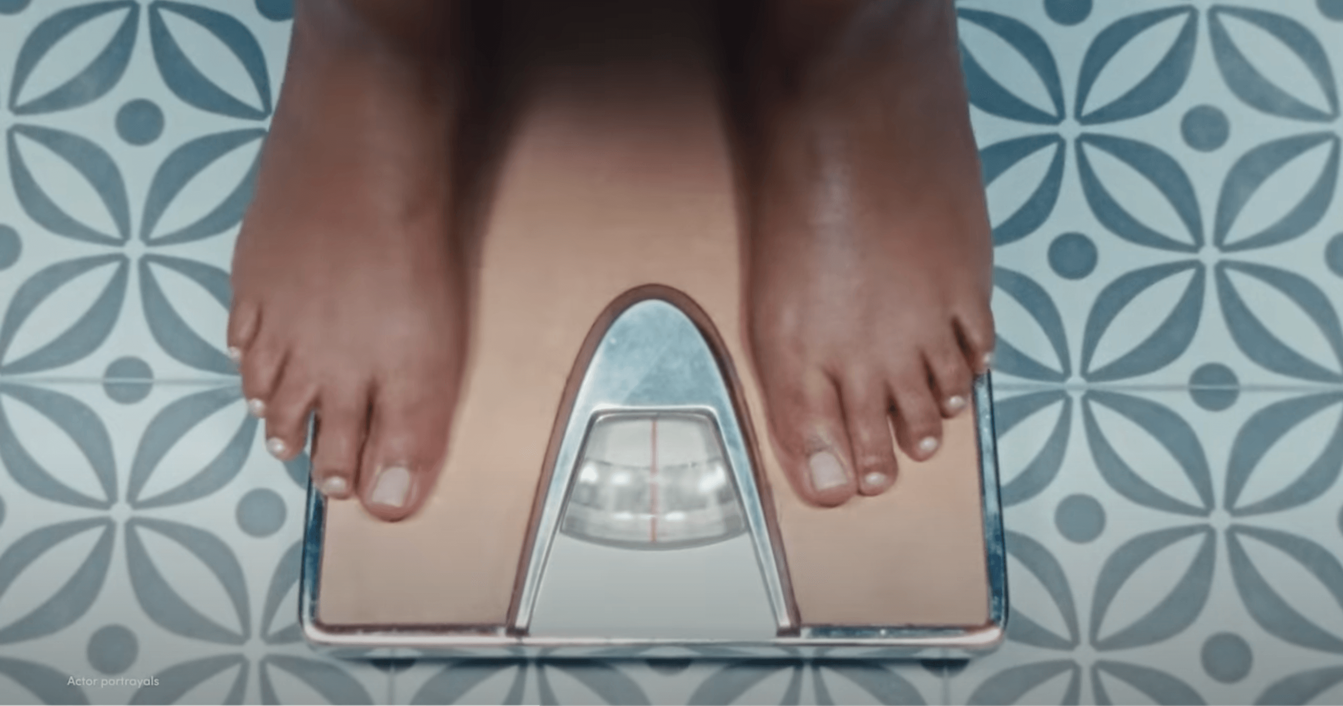 feet stand on a scale, from the hims and hers super bowl ad
